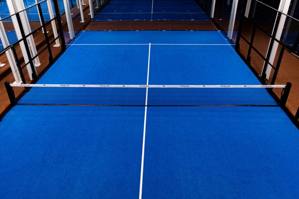 Level playing surface of an Evolve panoramic padel court