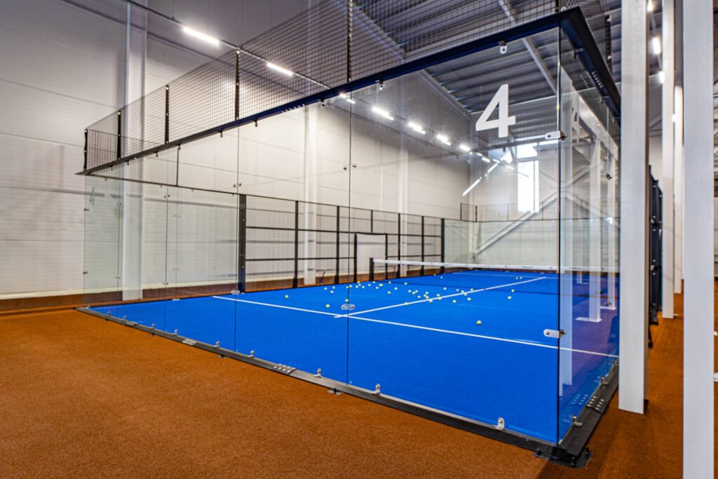 Evolve panoramic padel court seen from outside the glass wall